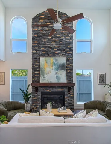 a living room with furniture and a fireplace