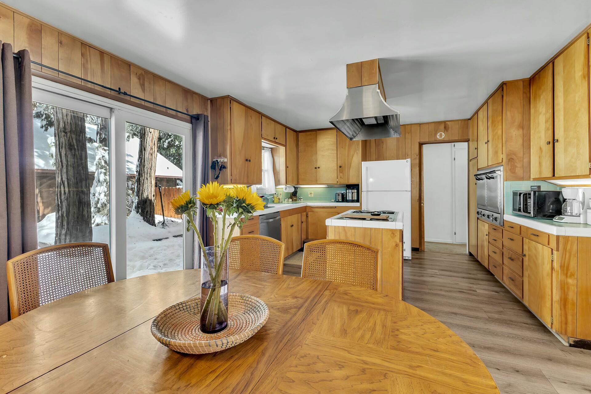 52660 Sylvan Way Idyllwild, CA 92549 - Photo 11 of 25 a living room with stainless steel appliances furniture a large window and kitchen view