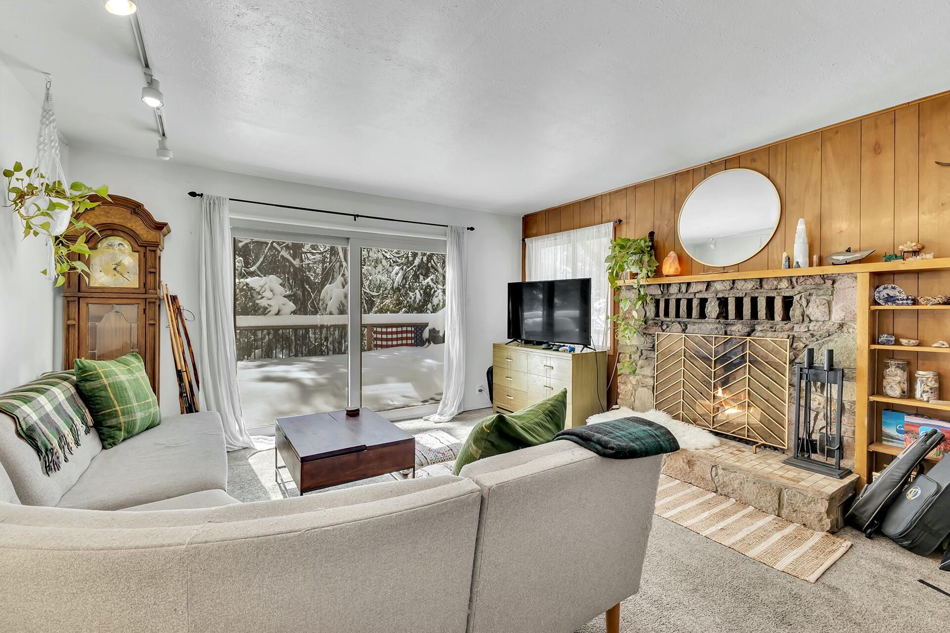 52660 Sylvan Way Idyllwild, CA 92549 - Photo 5 of 25 a living room with furniture a rug and a floor to ceiling window