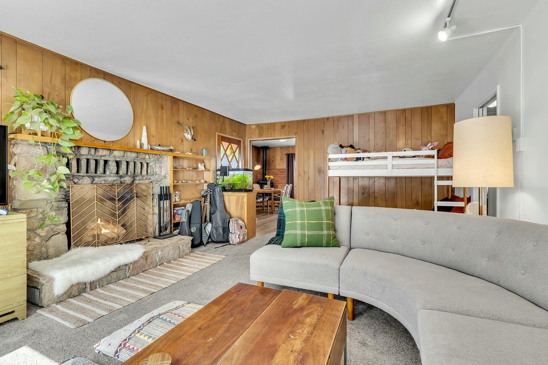 52660 Sylvan Way Idyllwild, CA 92549 - Photo 7 of 25 a living room with a couch and a chandelier