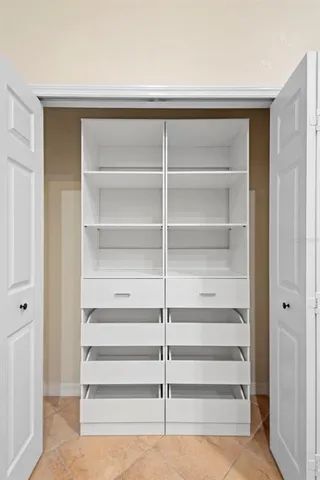 a view of a kitchen with a sink and cabinets