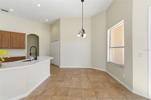 a view of a kitchen with a sink and a living room