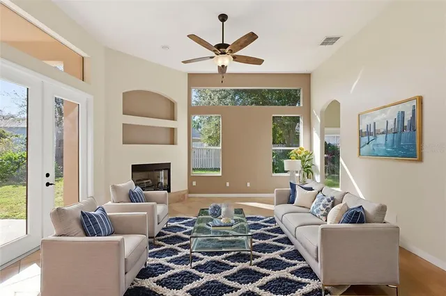 a living room with furniture and a fireplace