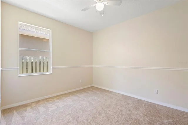 a bathroom with a sink vanity mirror and toilet