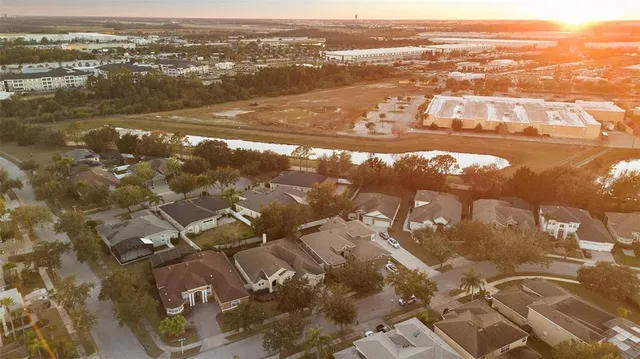 an aerial view of residential houses with outdoor space