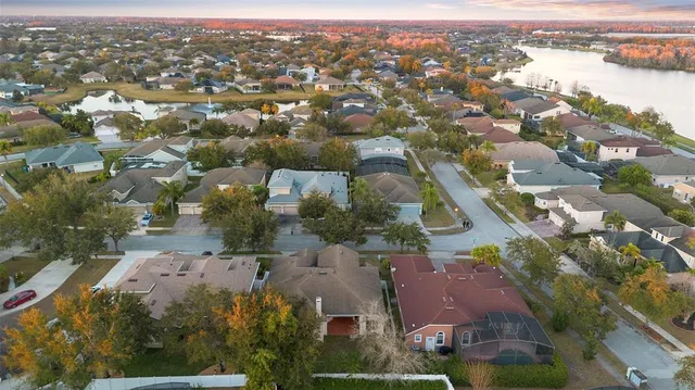 a view of a house with a yard and a fountain
