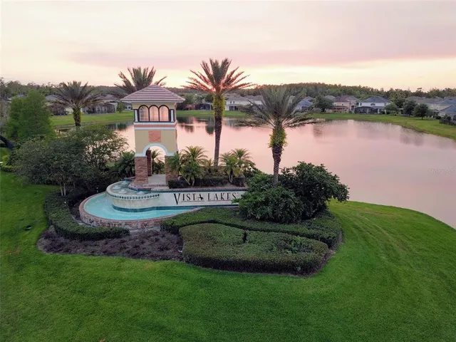 an aerial view of a house with swimming pool and outdoor space