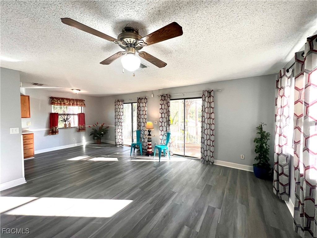 2002 Truman Avenue Alva, FL 33920 - Photo 16 of 30 a view of an empty room with wooden floor and a window