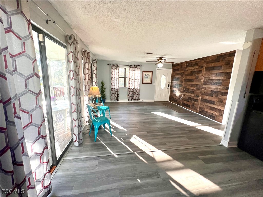 2002 Truman Avenue Alva, FL 33920 - Photo 18 of 30 a view of entryway with stairs and wooden floor