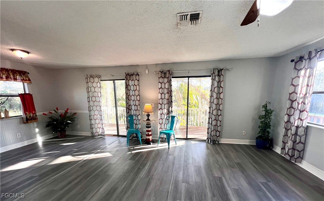 2002 Truman Avenue Alva, FL 33920 - Photo 9 of 30 wooden floor in an empty room with a window