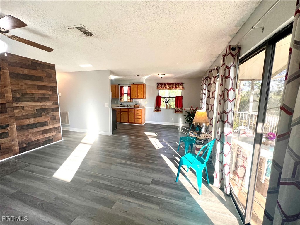 2002 Truman Avenue Alva, FL 33920 - Photo 10 of 30 a view of an entryway with wooden floor and a fire place