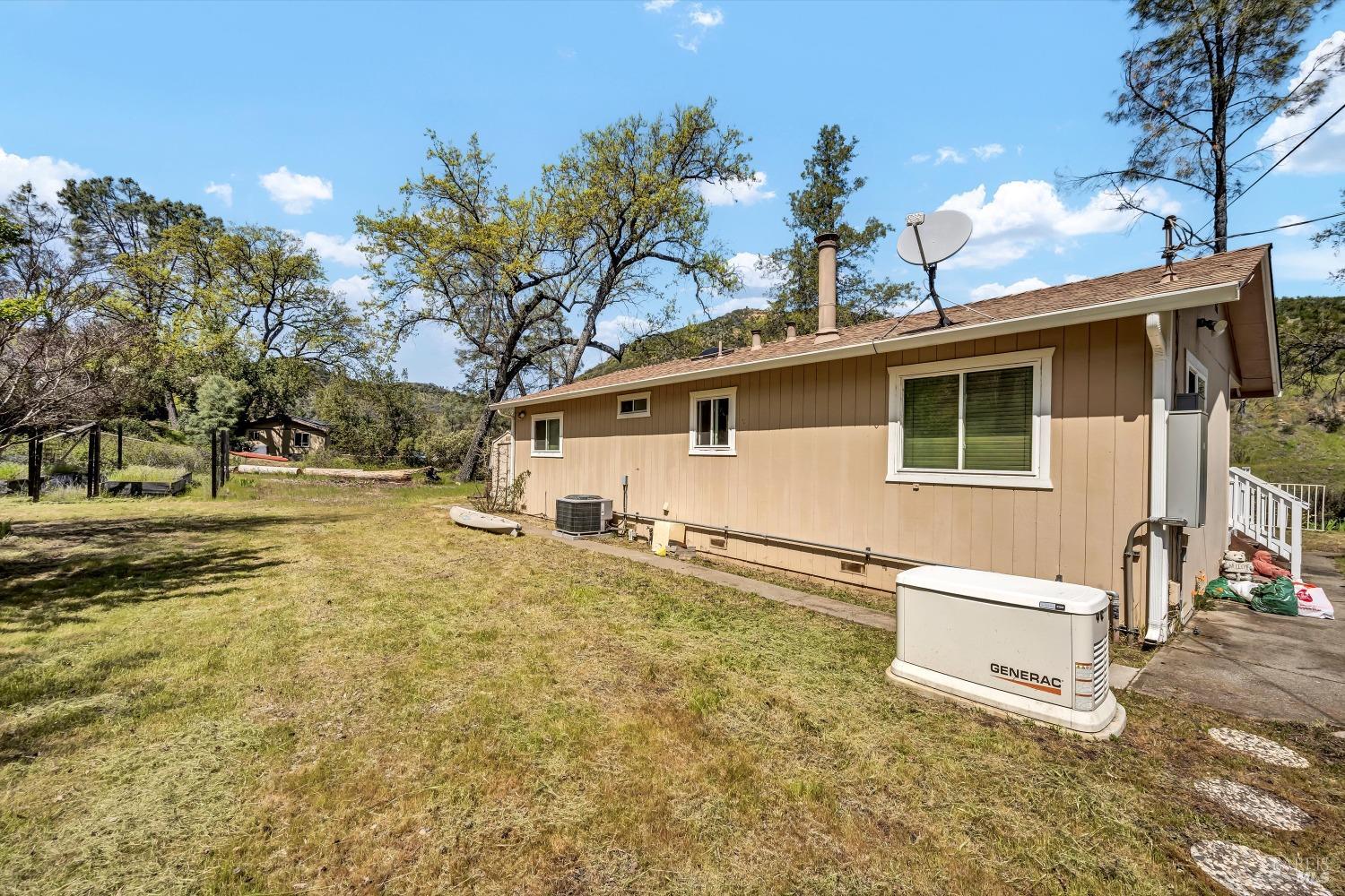 2230 Stagecoach Canyon Road Pope Valley, CA 94567 - Photo 20 of 29 a view of a house with snow on the wall