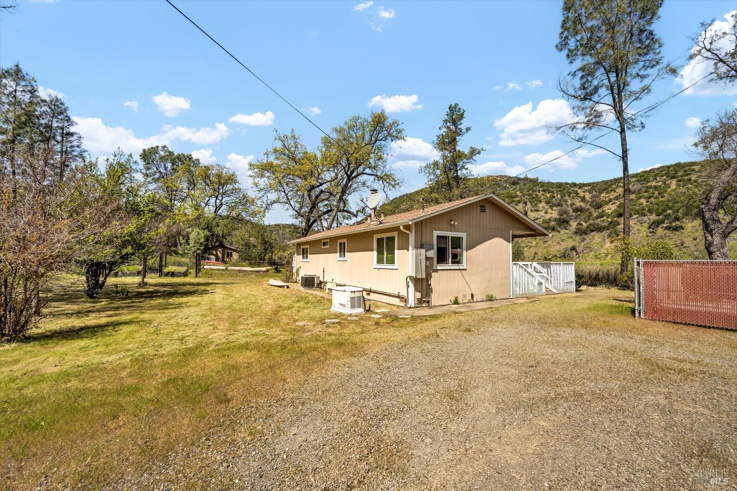 2230 Stagecoach Canyon Road Pope Valley, CA 94567 - Photo 22 of 29 a view of a house with a yard