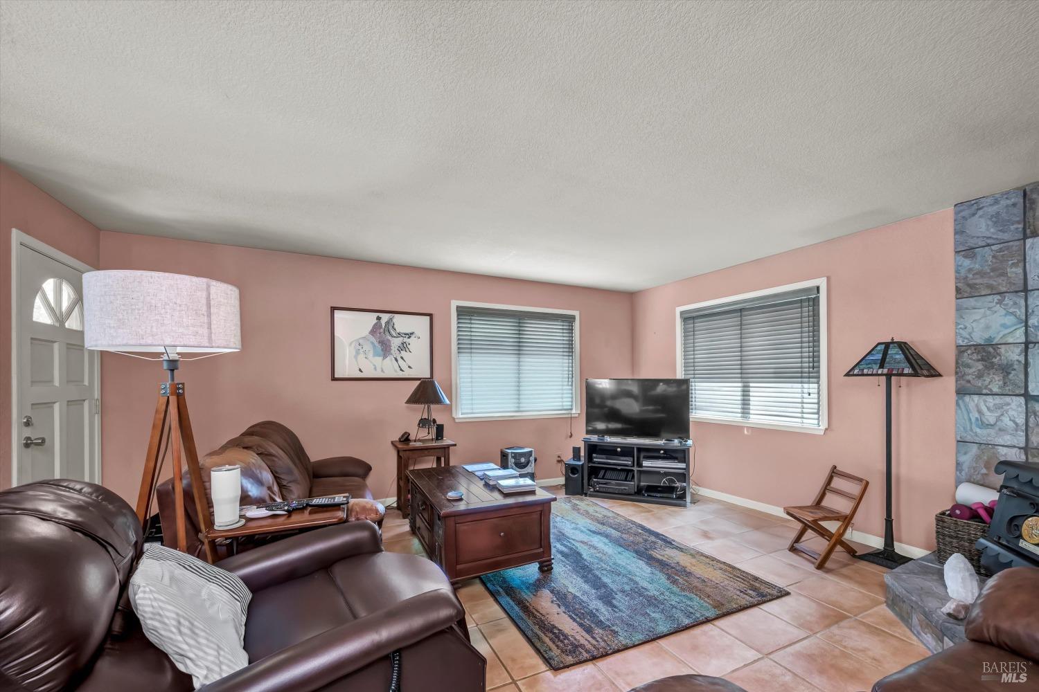 2230 Stagecoach Canyon Road Pope Valley, CA 94567 - Photo 3 of 29 a living room with furniture and a window
