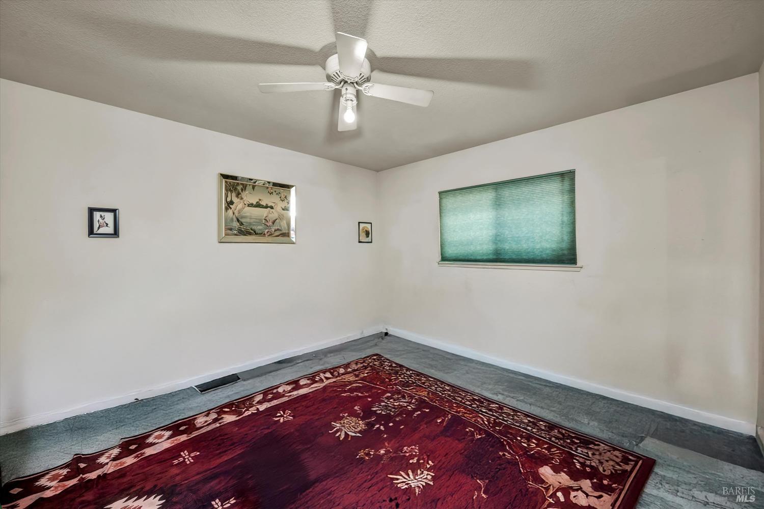 2230 Stagecoach Canyon Road Pope Valley, CA 94567 - Photo 8 of 29 a view of room with hardwood floor and ceiling fan