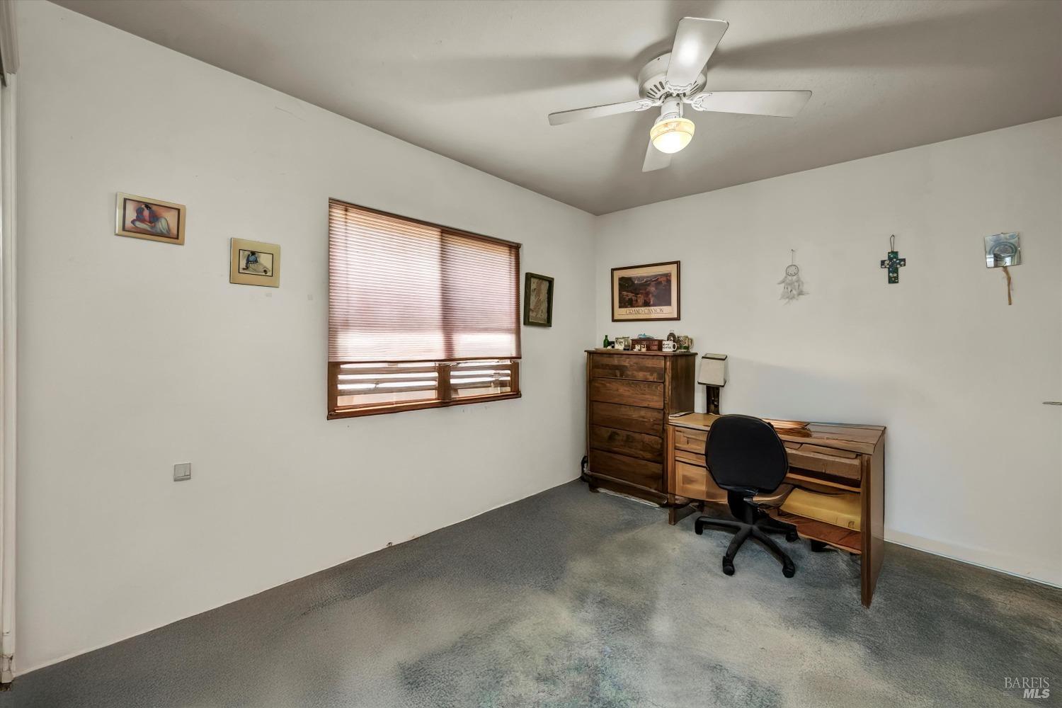 2230 Stagecoach Canyon Road Pope Valley, CA 94567 - Photo 9 of 29 a view of a workspace with furniture and a window