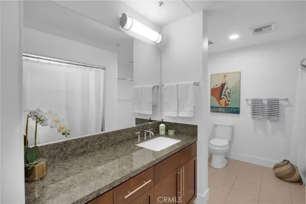 a bathroom with a shower and a toilet