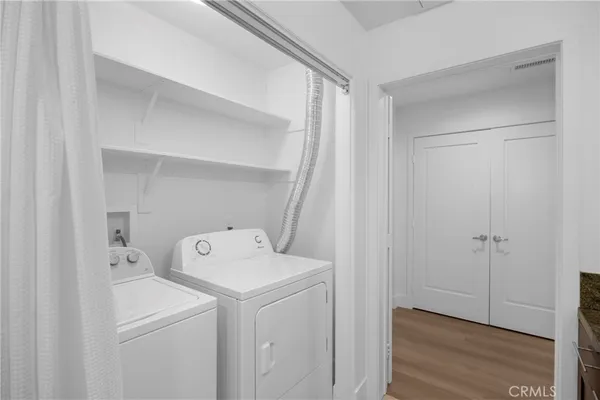 a bathroom with a granite countertop sink a toilet and a mirror