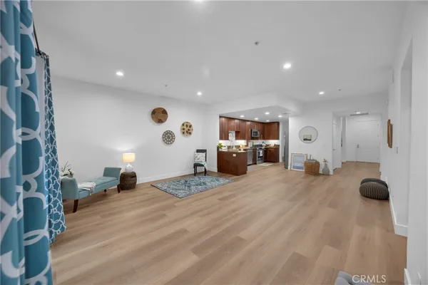 a bathroom with a granite countertop sink a toilet and a mirror