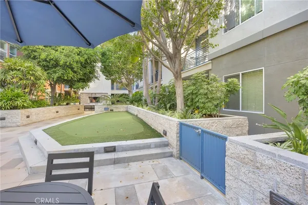 a view of a room with gym equipment and a view of living room
