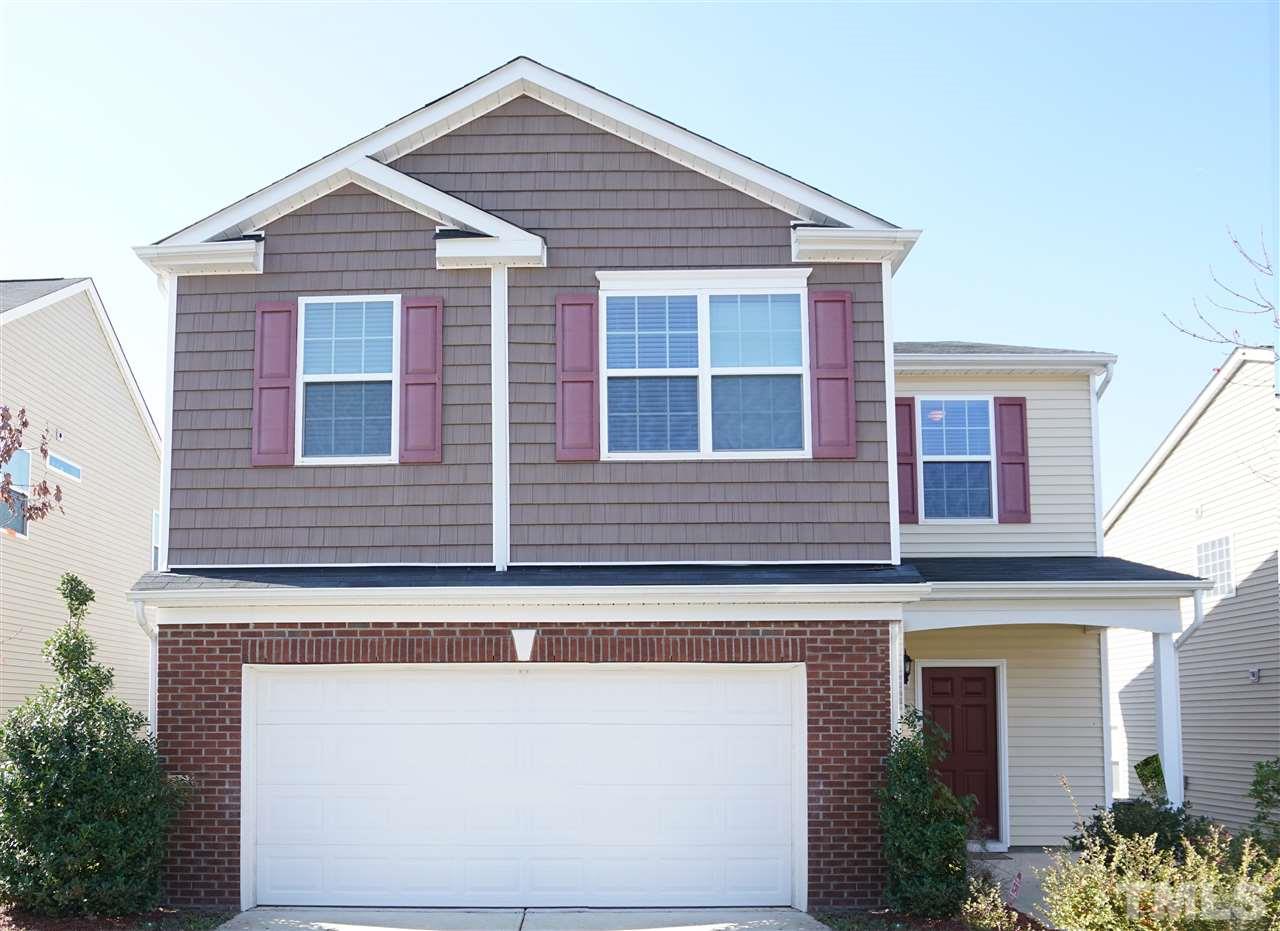 3716 Madeline Way Raleigh, NC 27610 - Photo 1 of 17 a front view of a house with large windows