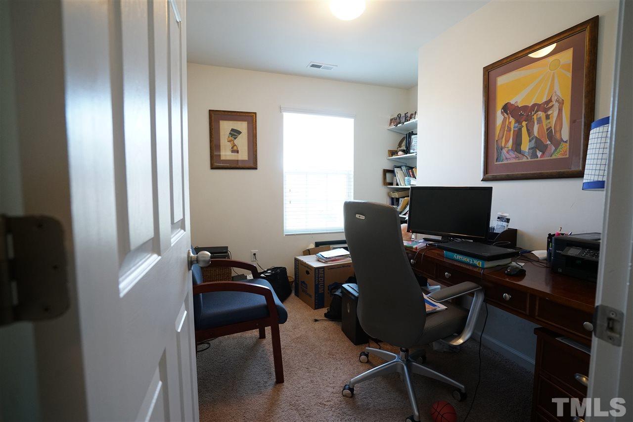 3716 Madeline Way Raleigh, NC 27610 - Photo 15 of 17 a view of a workspace with furniture and a window