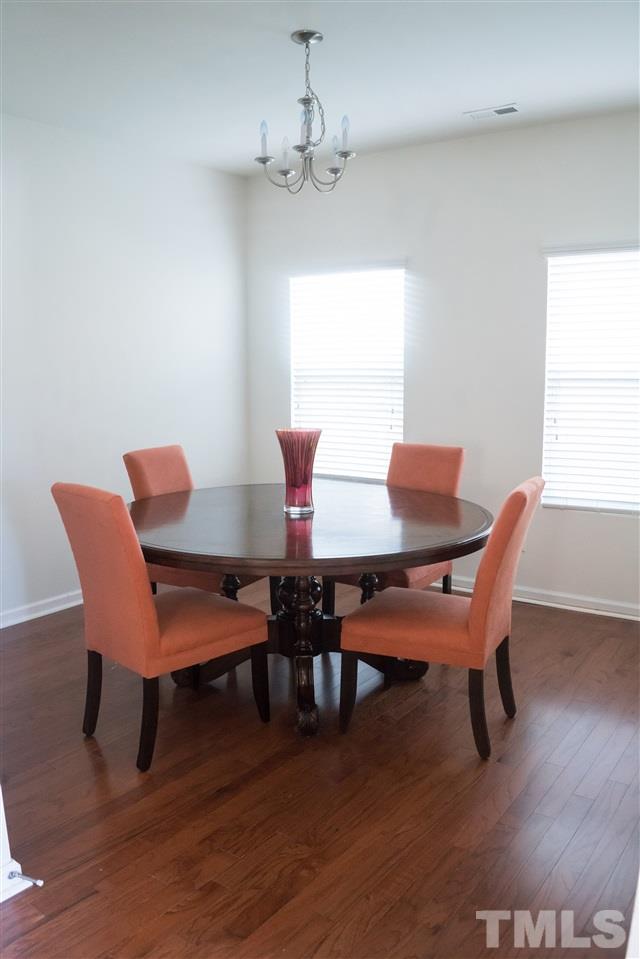 3716 Madeline Way Raleigh, NC 27610 - Photo 5 of 17 a dining room with furniture and wooden floor