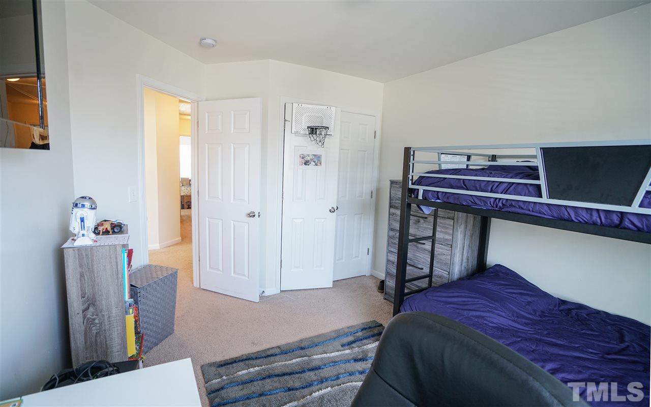 3716 Madeline Way Raleigh, NC 27610 - Photo 9 of 17 a bedroom with a bed and a window