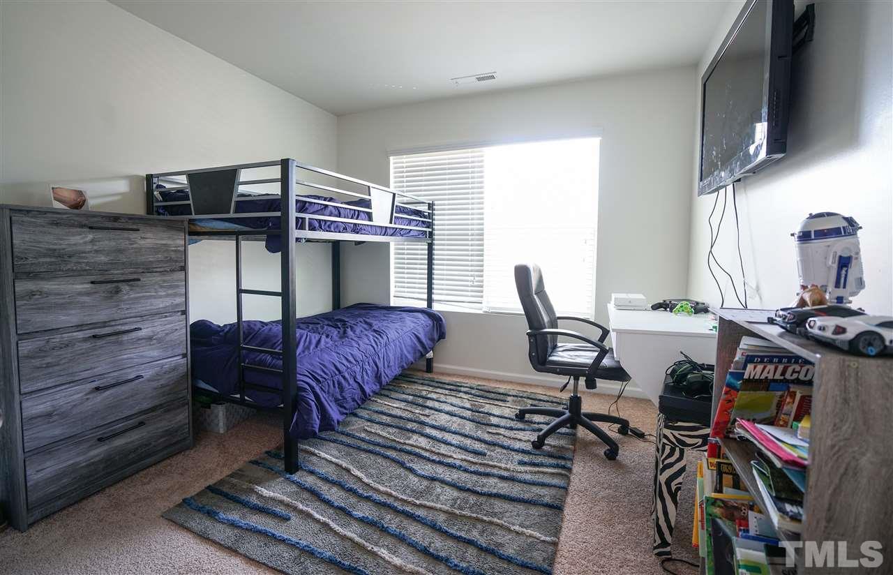 3716 Madeline Way Raleigh, NC 27610 - Photo 10 of 17 a workspace with furniture and a window