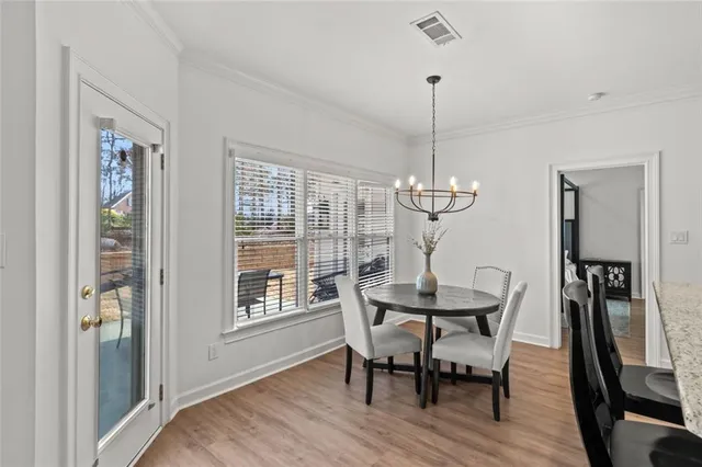 a spacious bedroom with a bed and a flat screen tv