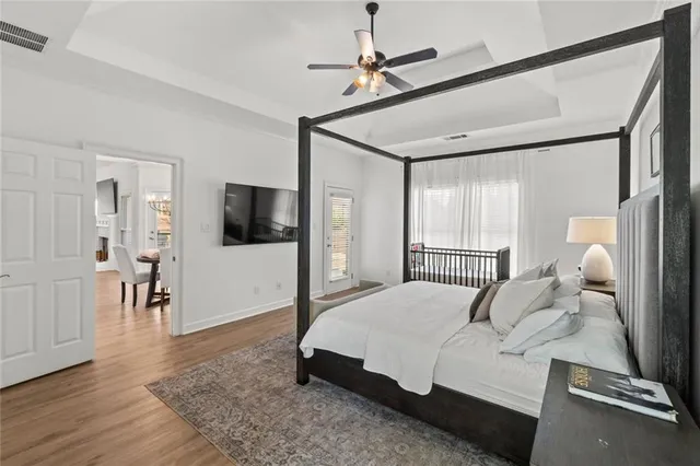 a bathroom with a tub shower and sink