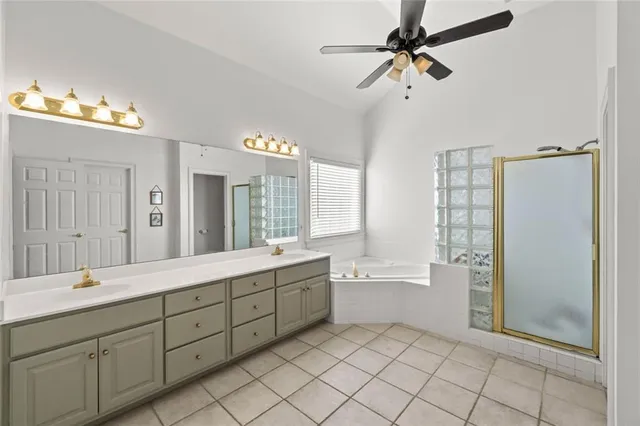 a spacious bathroom with a double vanity sink mirror and