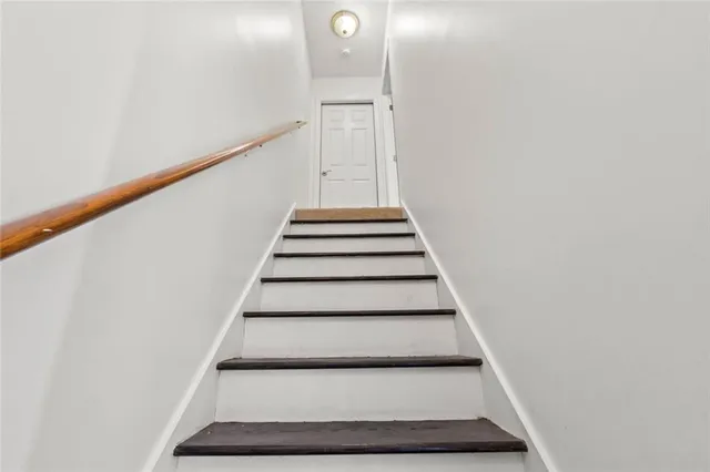 an empty room with windows and natural light