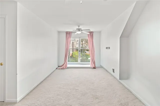 a front view of a house with a yard and seating space