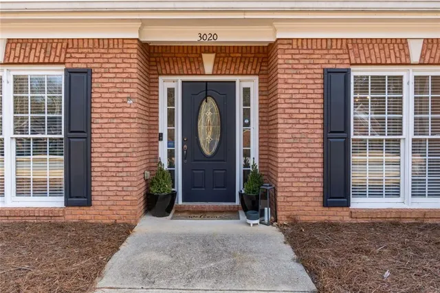 a front view of a house with a garage