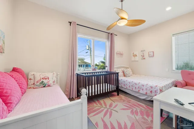 a bedroom with a bed and flat screen tv