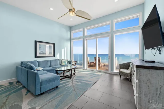a bedroom with a bed and a flat tv screen on dresser