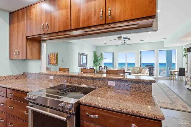 a bedroom with a bed and a ceiling fan