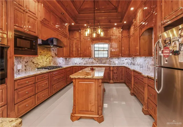 a kitchen that has a sink and a stove