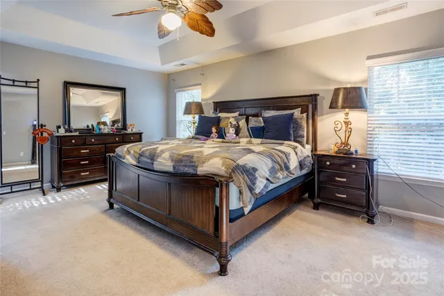 a bed room with a bed and a chandelier