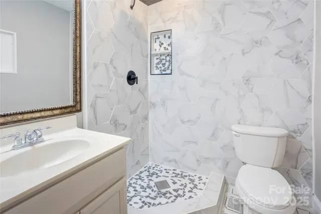 a living room with a bed furniture and a window