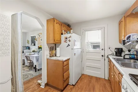 a kitchen with a sink cabinets and window
