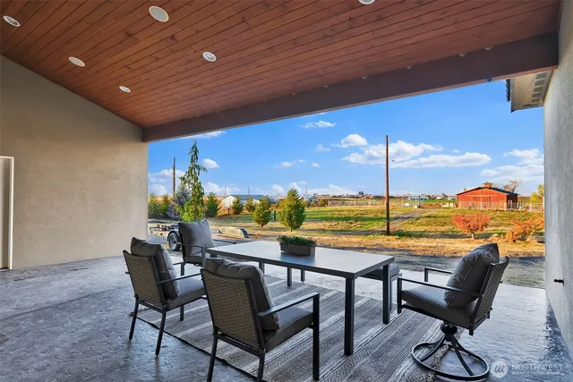 a view of swimming pool with outdoor seating
