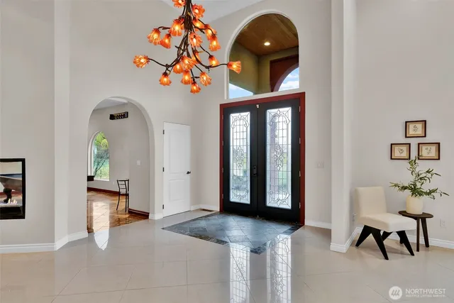a front view of a house with entryway and wooden floor