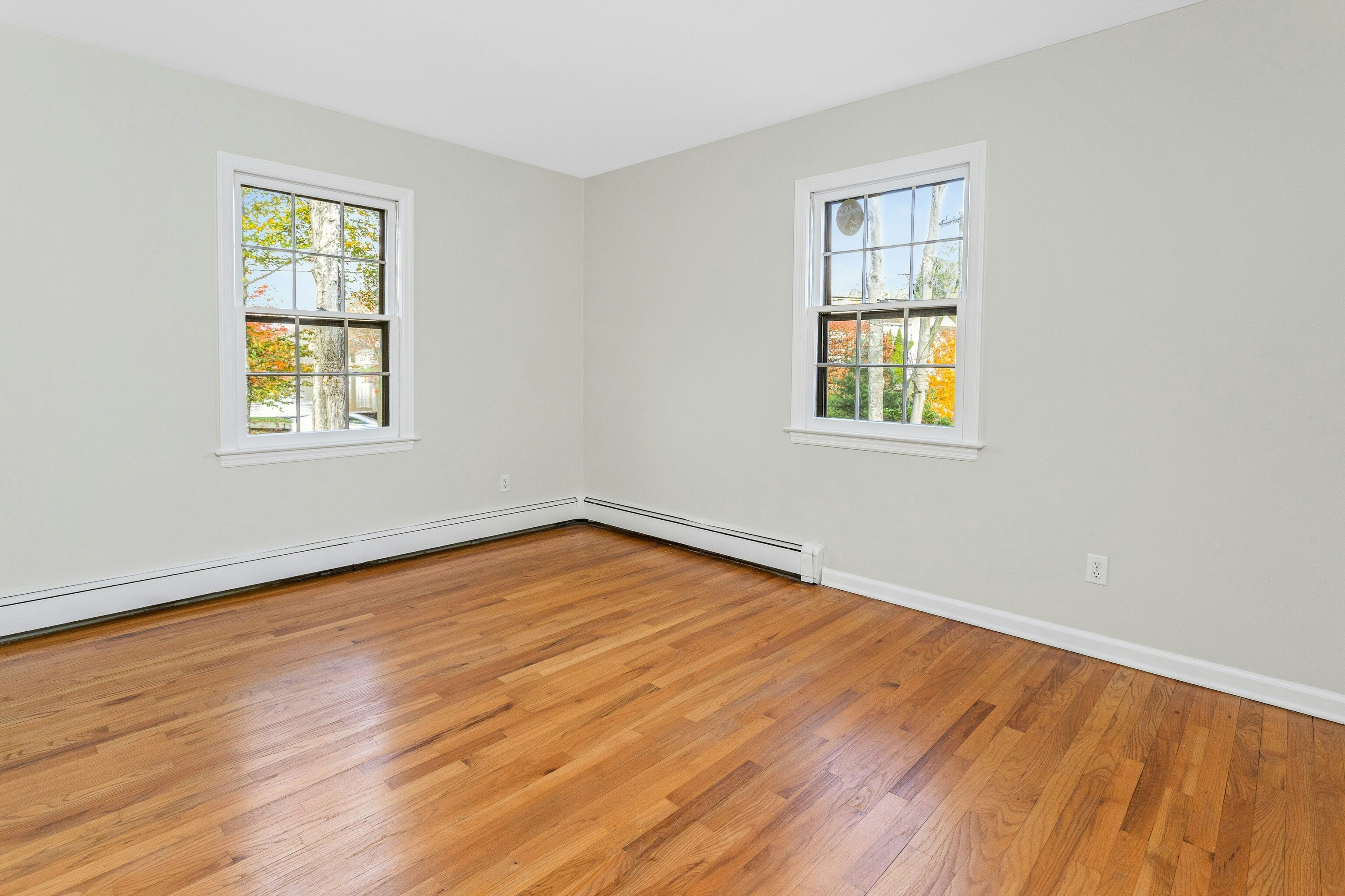64 Jelliff Mill Road New Canaan, CT 06840 - Photo 11 of 24 a view of an empty room with wooden floor and a window