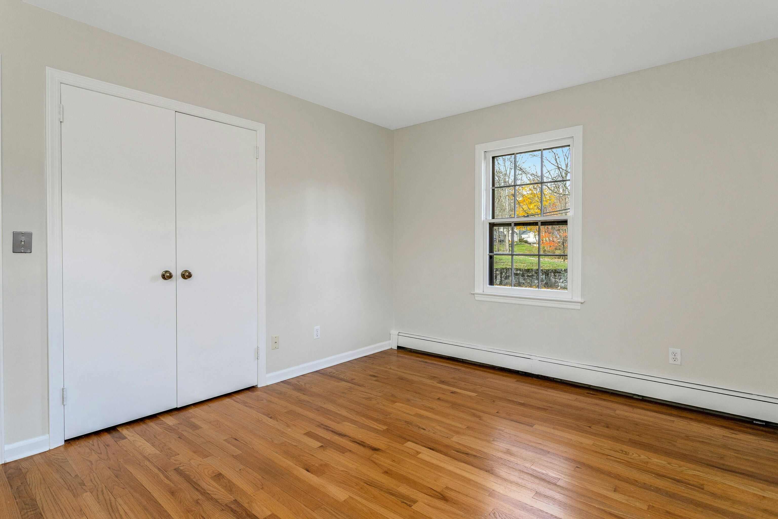 64 Jelliff Mill Road New Canaan, CT 06840 - Photo 12 of 24 a view of an empty room with wooden floor and a window
