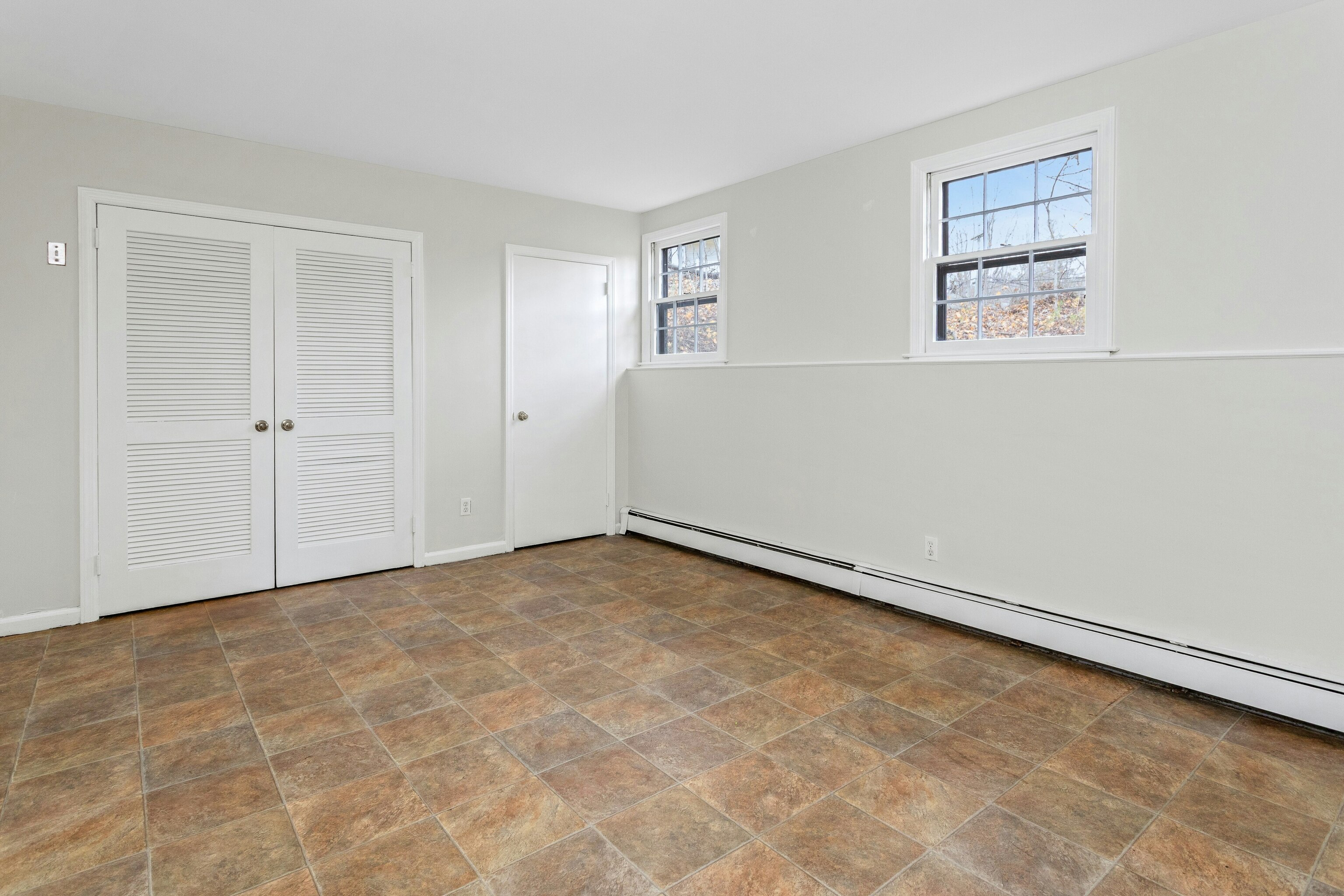 64 Jelliff Mill Road New Canaan, CT 06840 - Photo 18 of 24 a view of an empty room with a window