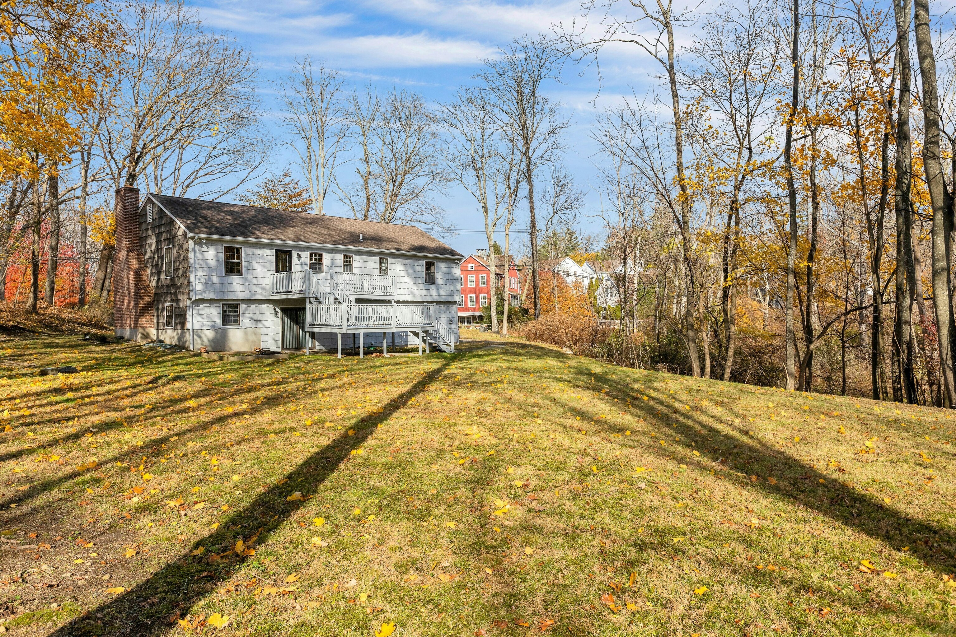 64 Jelliff Mill Road New Canaan, CT 06840 - Photo 23 of 24 a view of a house with a large tree