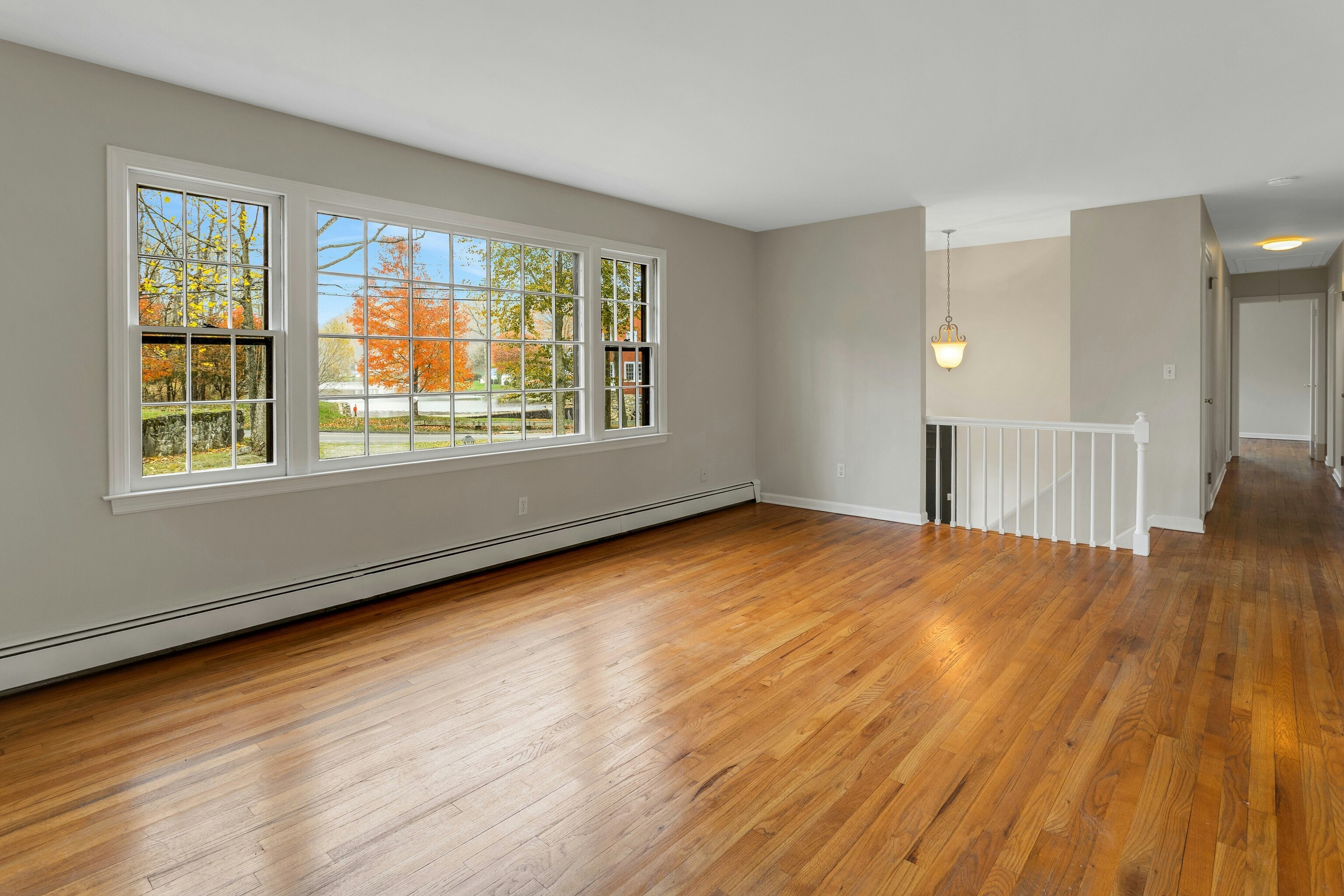 64 Jelliff Mill Road New Canaan, CT 06840 - Photo 3 of 24 a view of an empty room with wooden floor and a window