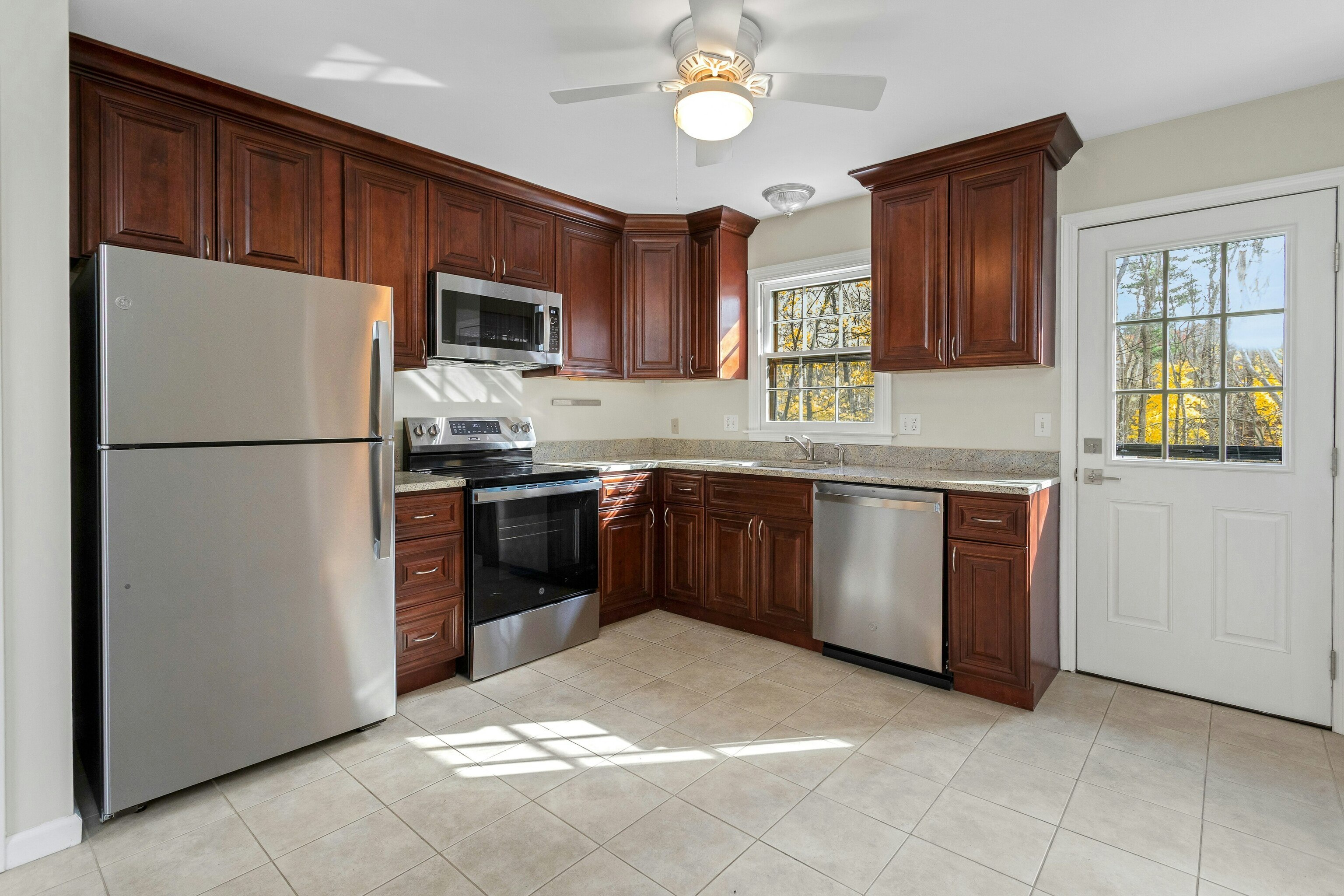 64 Jelliff Mill Road New Canaan, CT 06840 - Photo 8 of 24 a kitchen with stainless steel appliances granite countertop a refrigerator a sink a stove a microwave and island